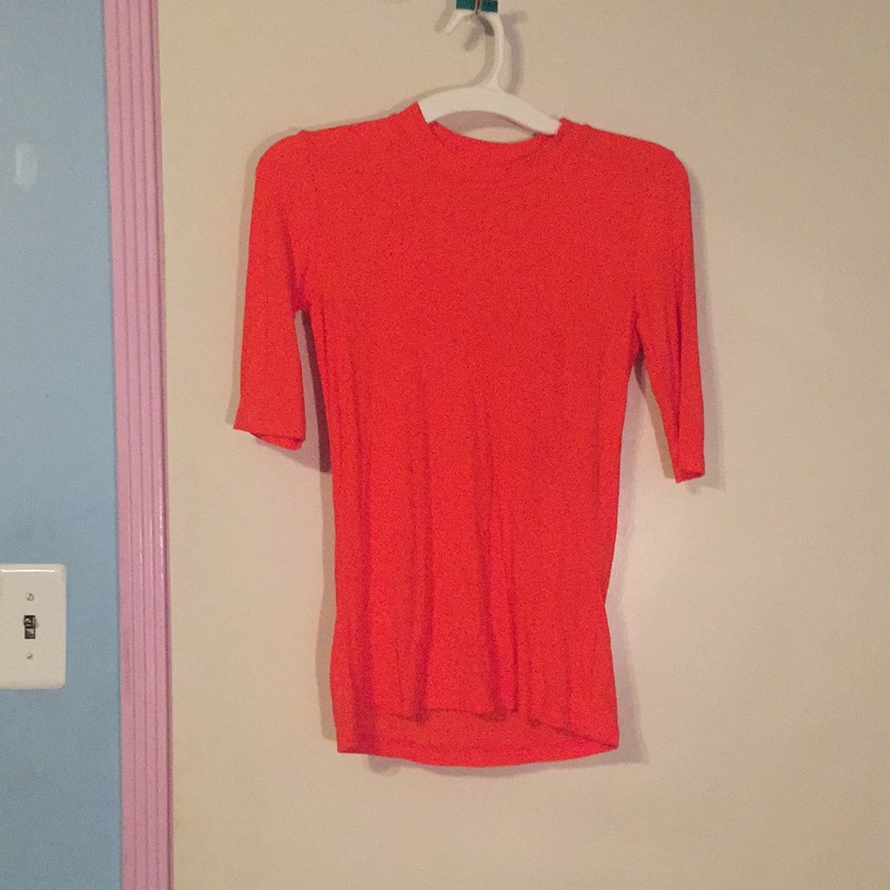 Quarter length sleeve with mock neck top.
